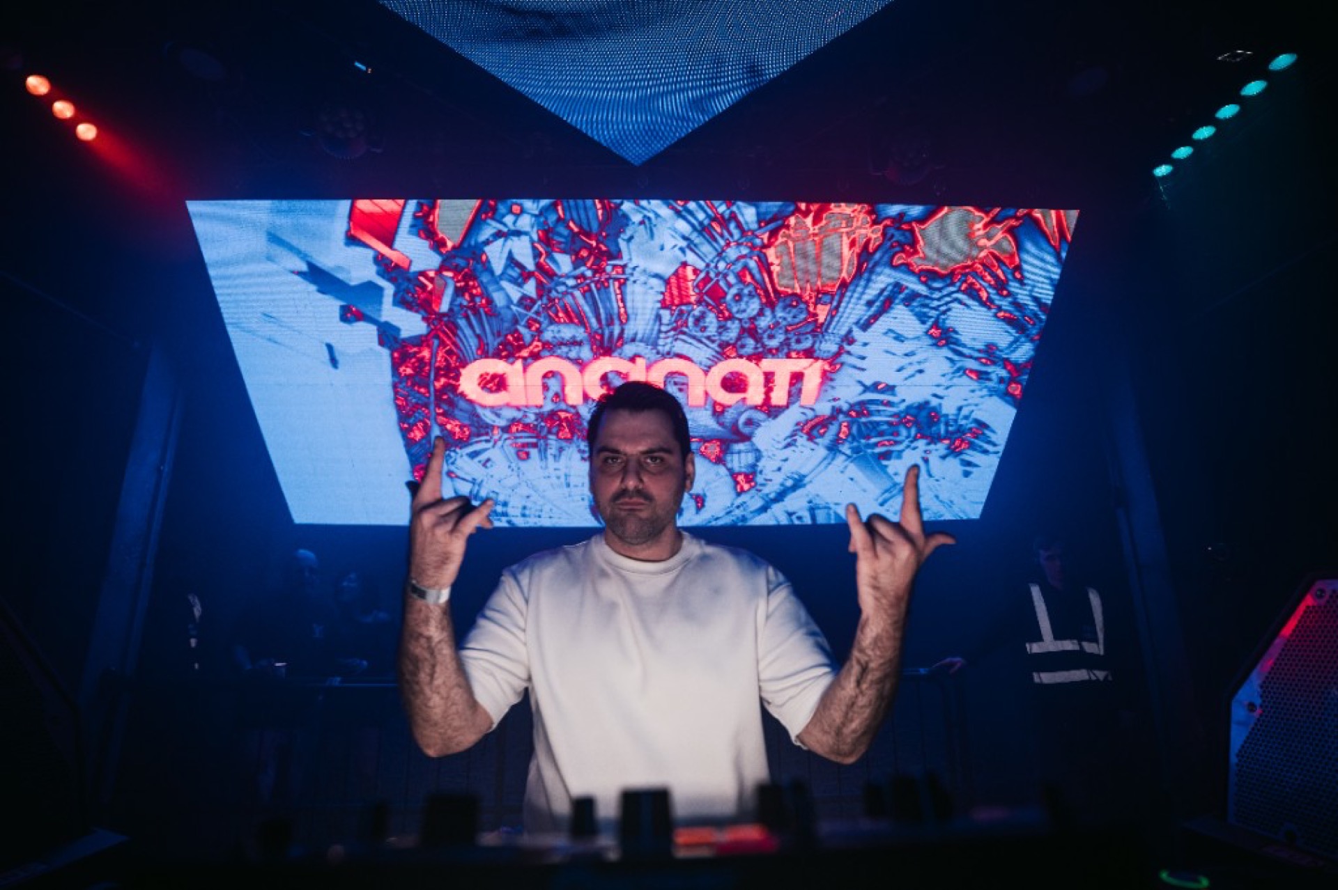 DJ Cincinati with arms raised — London nightclub Iranian music headline set