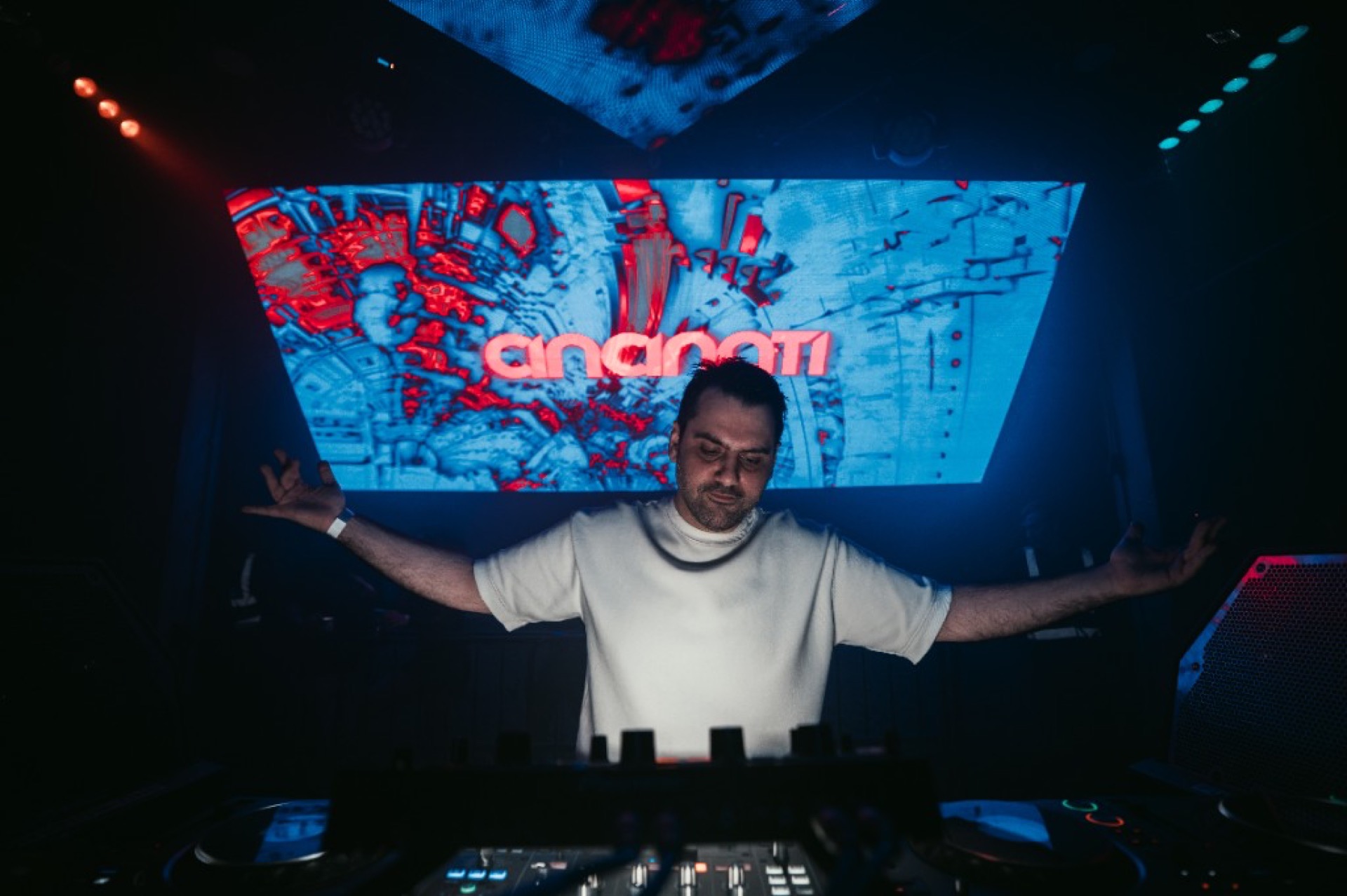 Blue-lit dancefloor at a London Persian music night — club photography