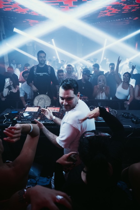 Portrait DJ at London decks — Iranian DJ bookings in the United Kingdom