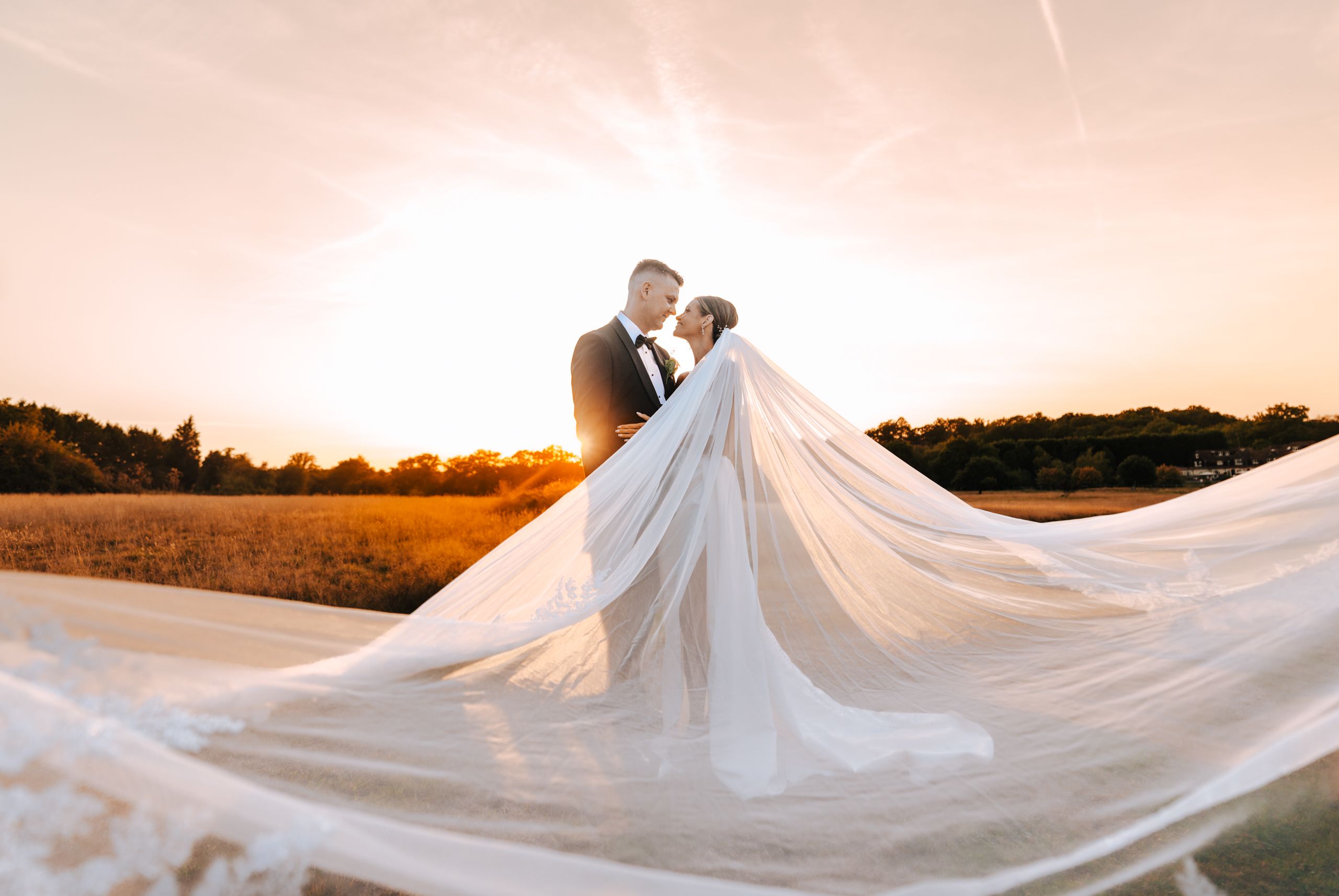 Bride and groom at sunset before wedding reception, highlighting wedding DJ timeline planning